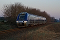 Le soleil n'a pas encore dépassé la cime des pins que le B 81597-98 passe, vu à Saint Martin d'Oney le 18.03.2009